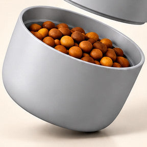 Close-up of the food cup filled with dry food